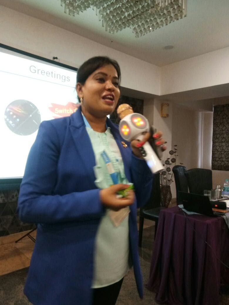 A presentation moment, sharing ideas with a microphone and visual aids.